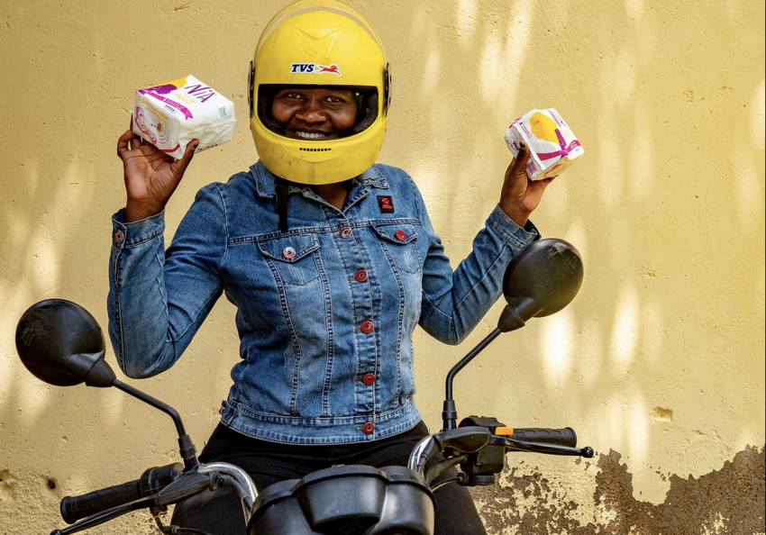 One of the boda girls showing off the menstrual hygiene products she keeps stocked for her female customers