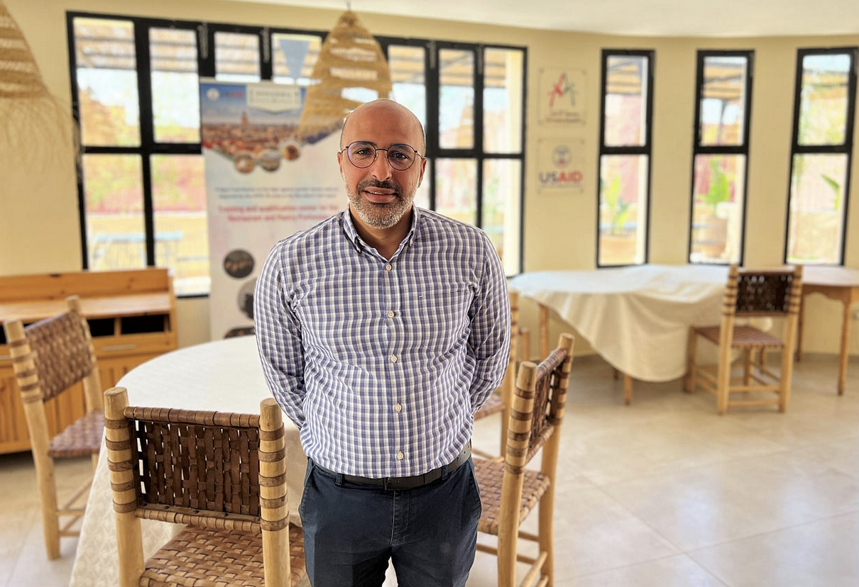 Hassan Naji, program manager of the Ennakhil Association, stands inside the solidarity restaurant and culinary training center. He joined Ennakhil in 2007 and has served as a key member behind Ennakhil’s work to advance women’s rights and fight gender-based violence. / Maggie Sullivan, USAID