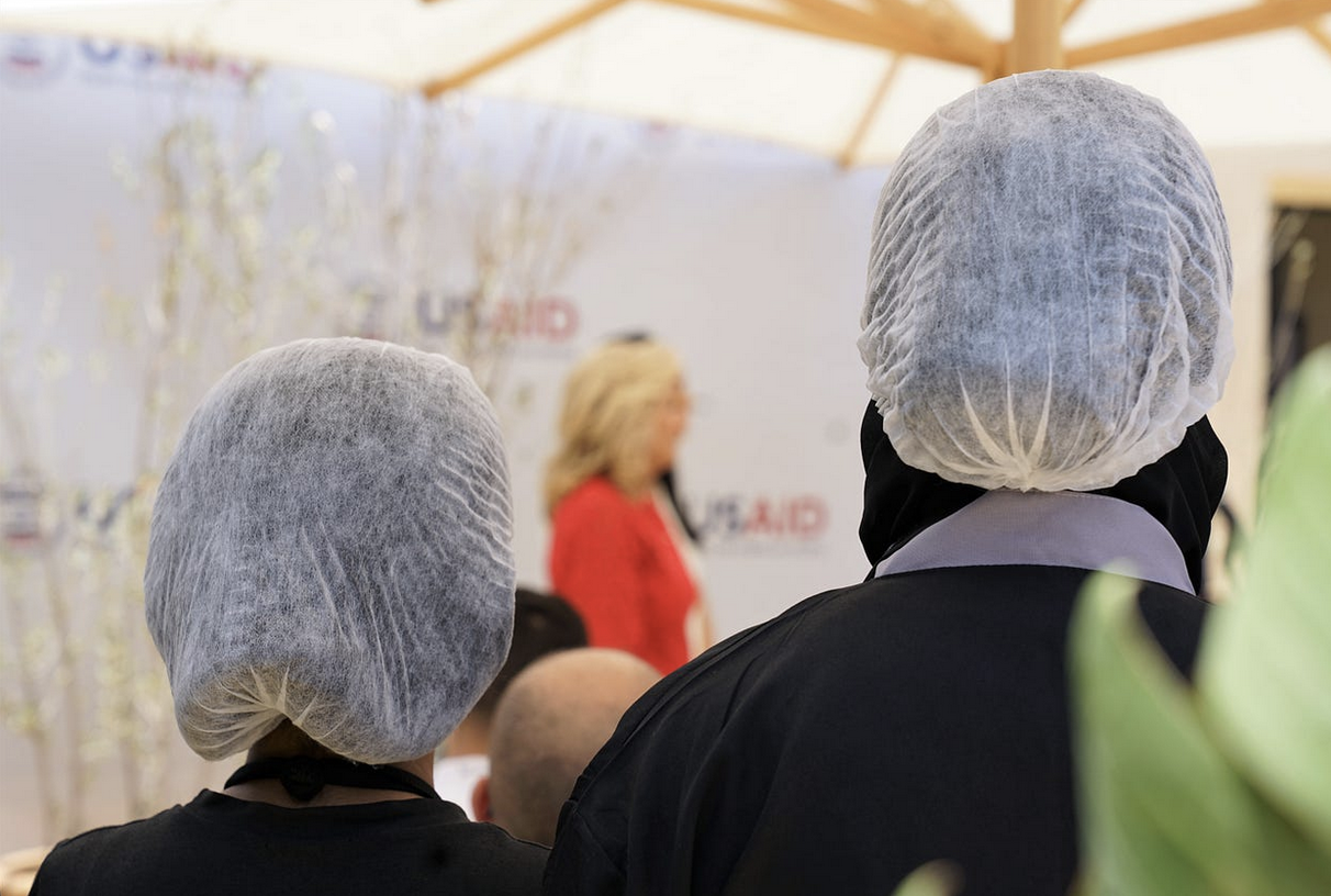 Culinary trainees listen to a speech given by U.S. First Lady Dr. Jill Biden during her visit to the Ennakhil Association in Marrakech, Morocco on June 4. / Katie Bercegeay, USAID