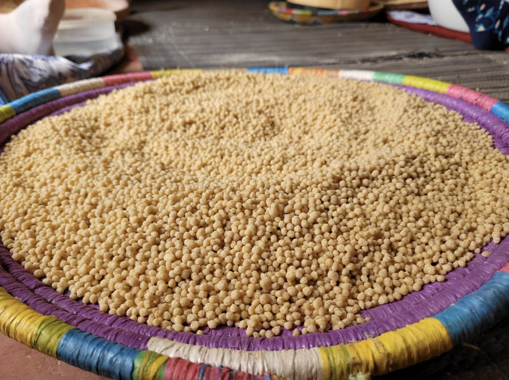 Couscous in the process of being hand-made by the cooperative from village whole wheat flour. Andrew Monahan, USAID