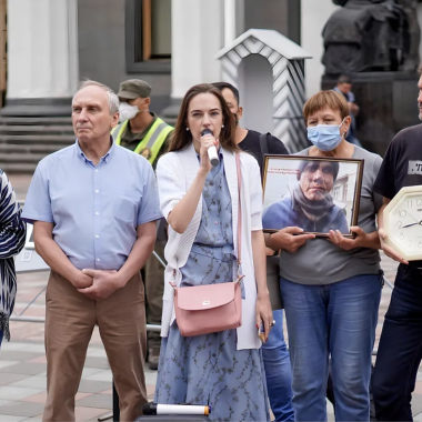 A group of people hold a rally near the Verkhovna Rada building in Ukraine.